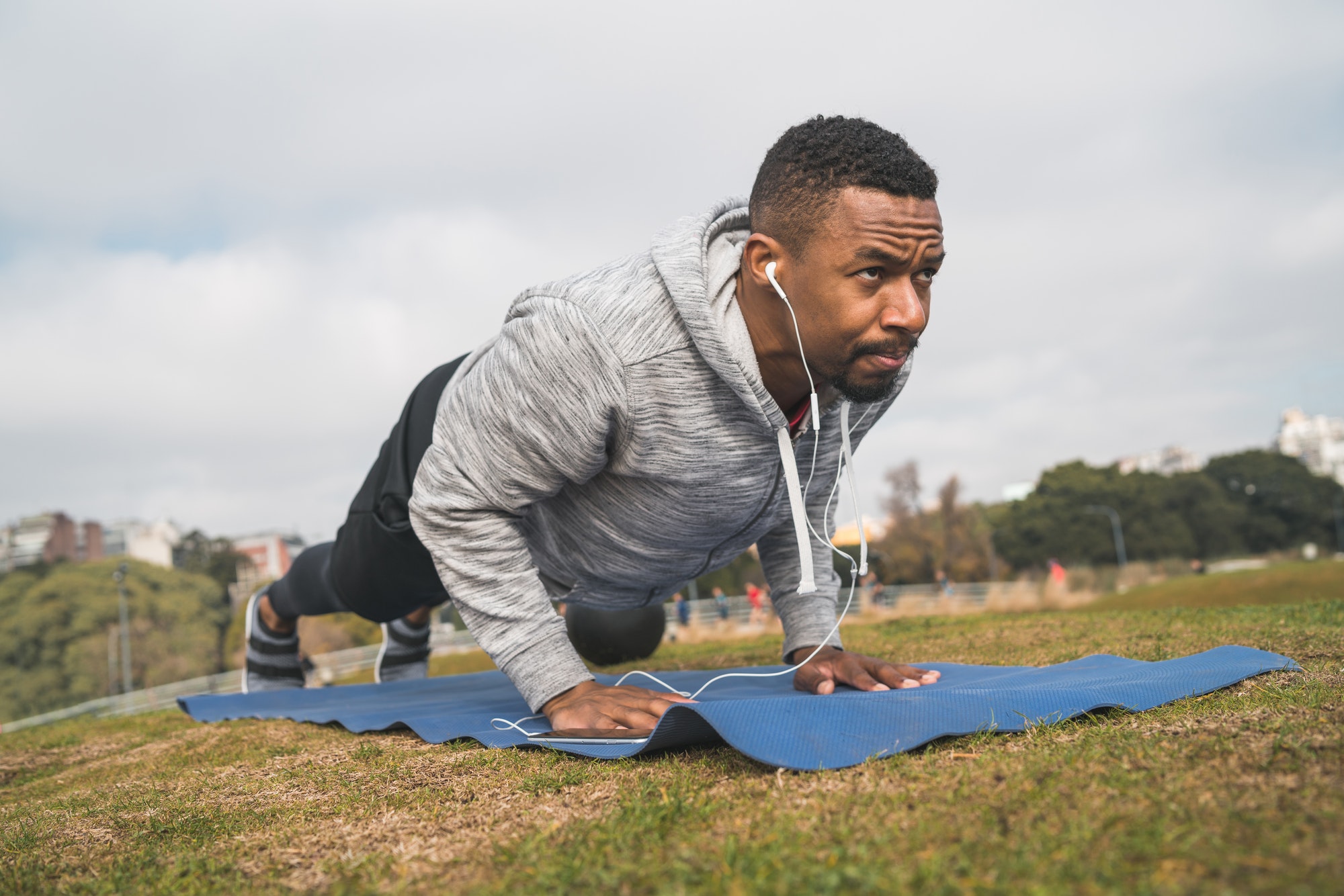 Athletic man doing push ups.